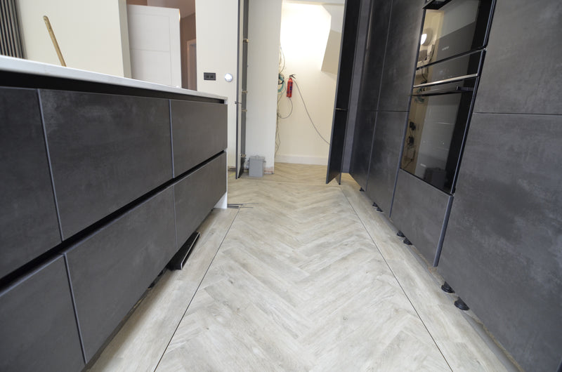 j2 Flooring Herringbone LVT - Glacier Oak - fitted in Kitchen with full tile border and contrasting design strip