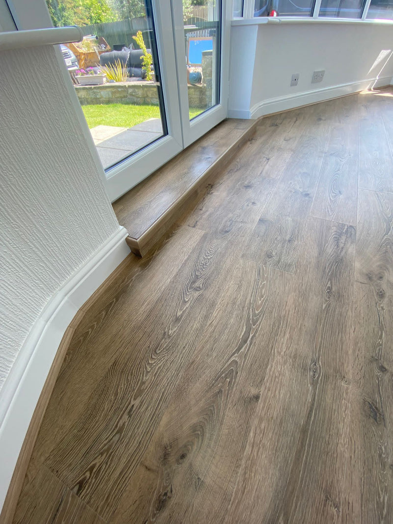 Balterio Traditions Laminate - Industrial Brown Oak - fitted in Conservatory, with specialised Incizo nosing to step edge