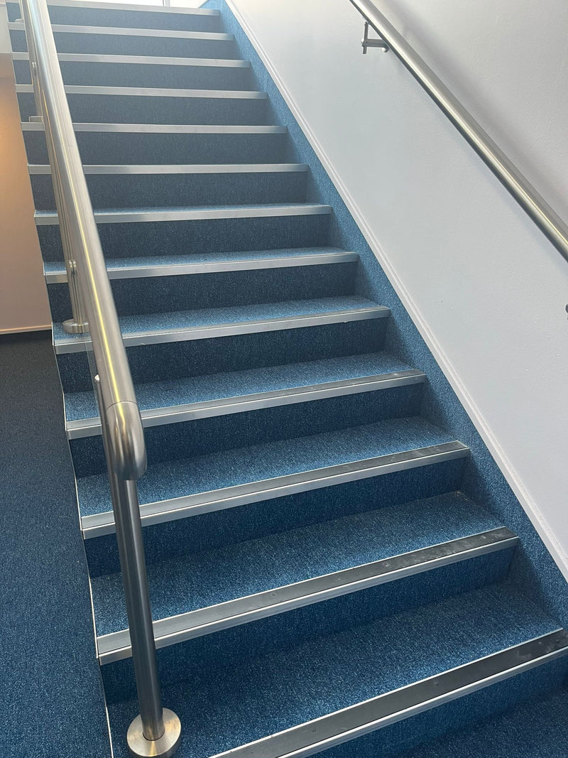 Burmatex GoTo Carpet Tile - Sea Blue - fitted on staircase with commercial nosings to circulation area