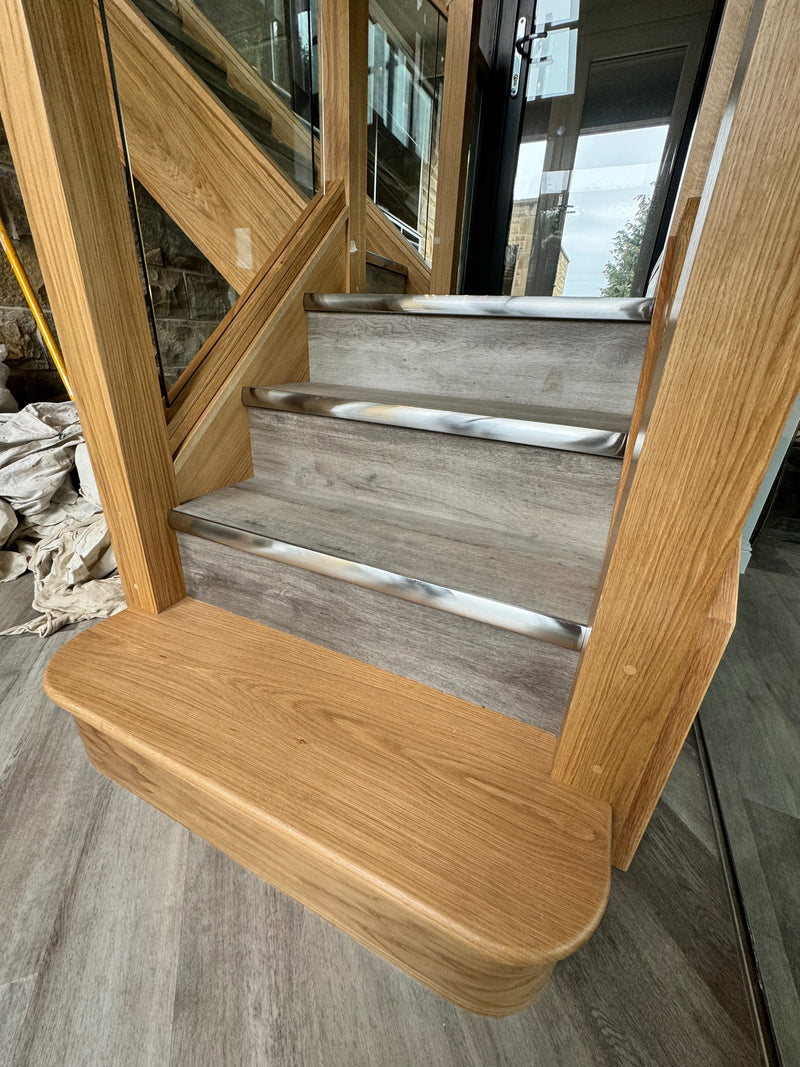 Forbo Allura Flex LVT fitted alongside Stairrods Premier Trim Full Bull nosings on Staircase