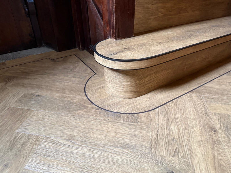 J2 Flooring Natural Timbers Parquet - Carpenters Oak  - fitted in Hallway with contrasting design strips, leading on to staircase with StairRods Antique Bendy Bull